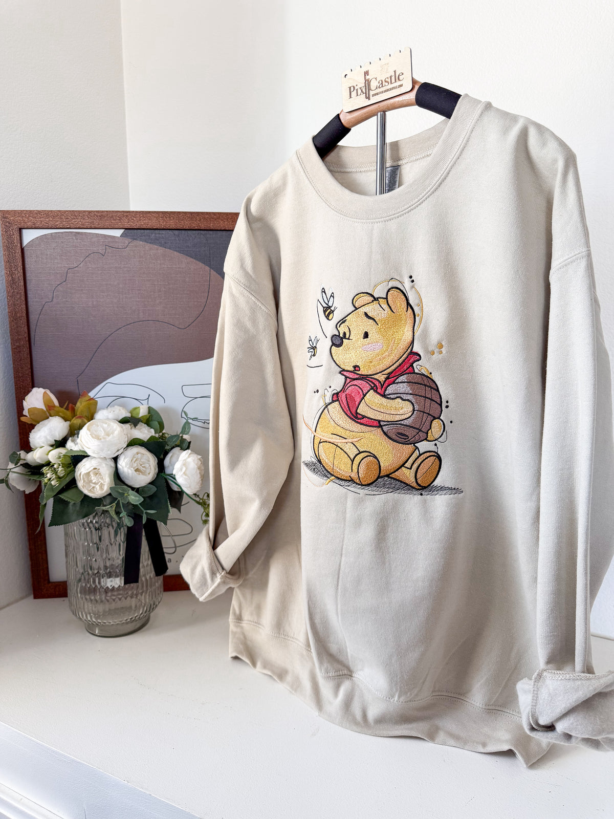 Pooh’s Honey Pot Adult Embroidered Sweatshirt and T-Shirt